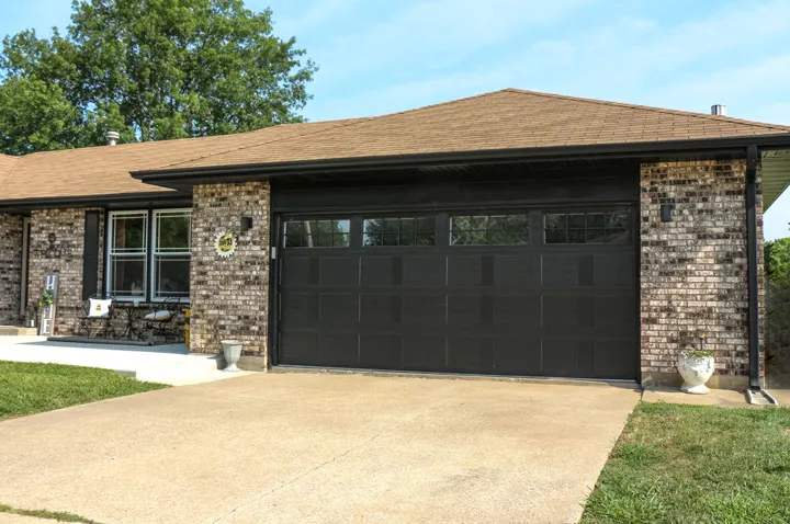 Country Manor garage door shown on a home