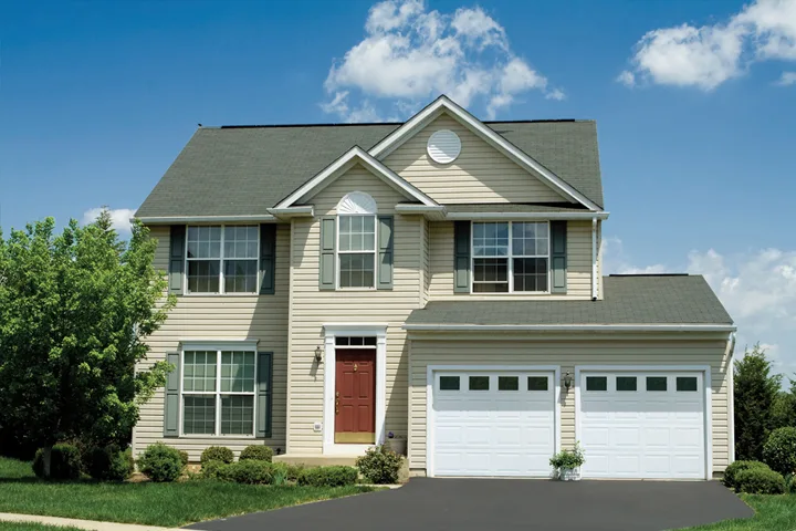 TradeMark garage door shown on a home